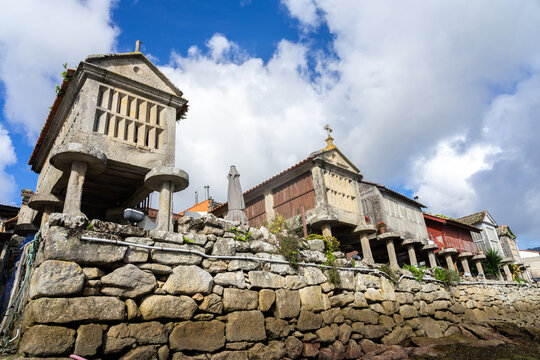 Fishing village of Combarro with the typical horreos (fish drying sheds). Galicia, Spain.