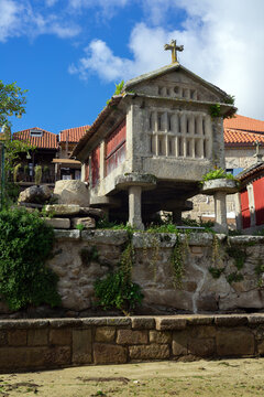 Fishing village of Combarro with the typical horreos (fish drying sheds). Galicia, Spain.