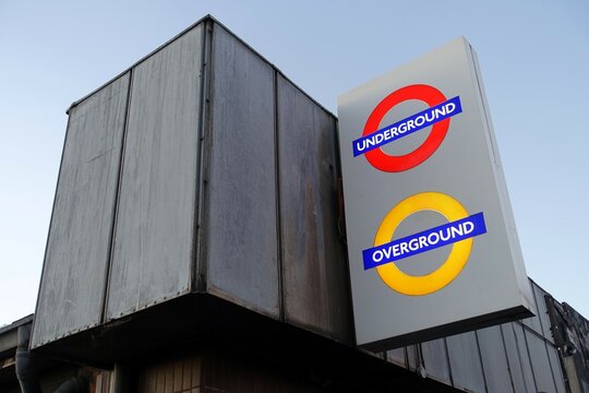 Illuminated roundel signs for London Underground and London Overground at outside station