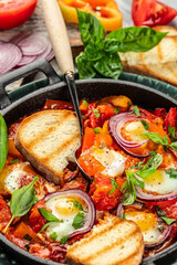 Frying pan with fresh shakshuka, Middle eastern traditional dish, Food recipe background. Close up
