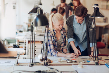 Diverse artists working on design in modern office