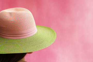 Close-up of a pink fashion women summer hat. Minimal concept fashion summer hats, pastel colors, female accessories store.