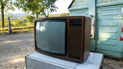 Old vintage analog television on a sunny day