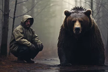 Foto op Plexiglas brown bear in the forest with a man © Daniel