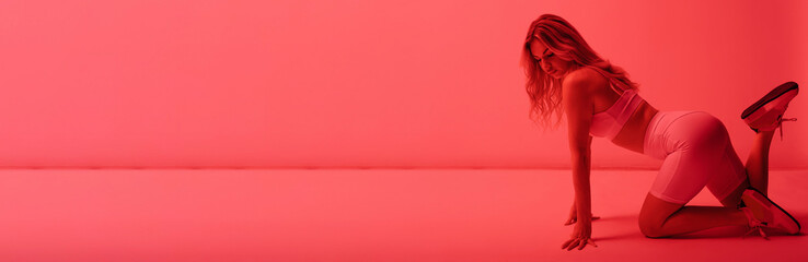 Sensual attractive blonde model posing in underwear at red neon light studio - obrazy, fototapety, plakaty