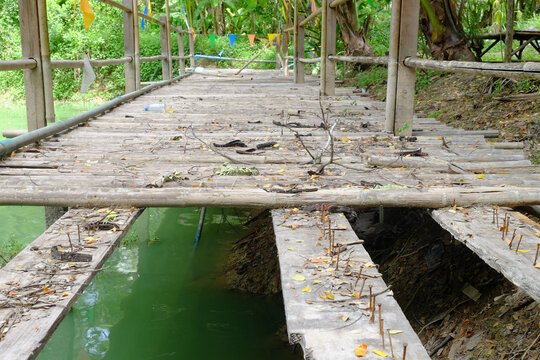 Broken walkway on the balcony over the lake