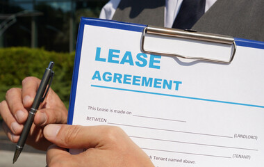 Concept of commercial, lease, tenancy, contract, property or commercial laws: the first page of lease agreement - obrazy, fototapety, plakaty