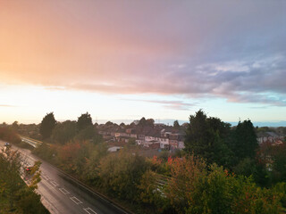 Luton and Dunstable Town's Aerial Footage of Borders of Both Neighbouring Towns of England UK During Orange Sunset