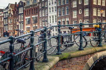 Fototapeta na wymiar Bicycles in a canal in Amsterdam, Holland