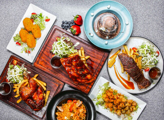bbq pork ribs, bbq spring chicken, American Beef Wing, Spaghetti with Seafood Lobster Sauce, Crispy Chicken Cartilage, Cheese Cream Crab Cakes, Espresso Chocolate Hot Cake top view of hong kong food