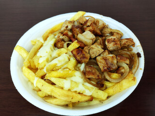 Loin portion, fries and onion in polystyrene packed lunch very common in Brazil known as marmitex (marmita) (packed lunch)

