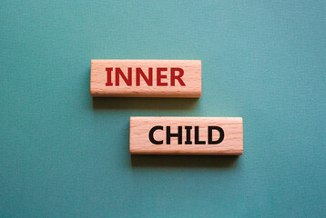 Inner Child symbol. Wooden blocks with words Inner Child. Beautiful grey green background. Business and Inner Child concept. Copy space.