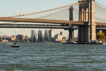 Fototapeta na wymiar The Manhattan bridge and the Brooklyn Bridge as seen from a ferry on the East River
