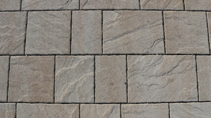 graphic resource of a fragment of a pavement or wall lined with gray stone tiles, a textured...