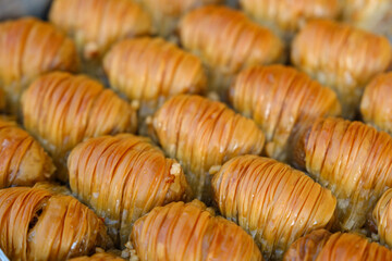 Diagonal overhead shot of different shaped baklava, shot of fresh pistachio baklava, nut 