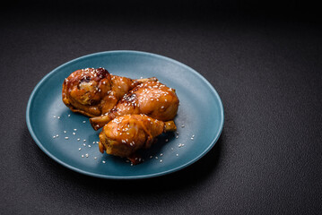 Delicious Asian dish with chicken legs in teriyaki sauce with salt and spices