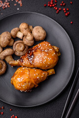 Delicious Asian dish with chicken legs in teriyaki sauce with salt and spices