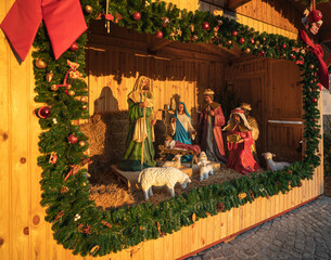 Wooden house with Holy Family at a christmas fair in Budapest