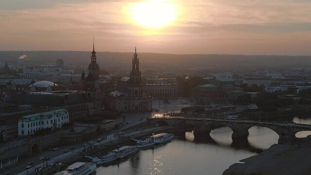 Perfect aerial top view flight drone. Sunset town Dresden Cathedral Bridge River