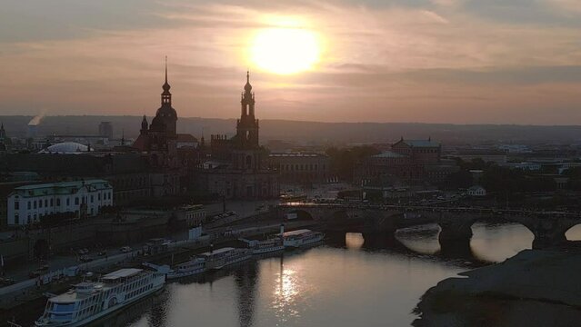 Best aerial top view flight drone. Sunset town Dresden Cathedral Bridge River