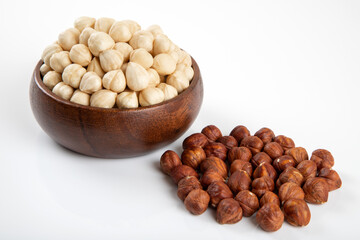 Group of peeled and shelled hazelnuts on white background