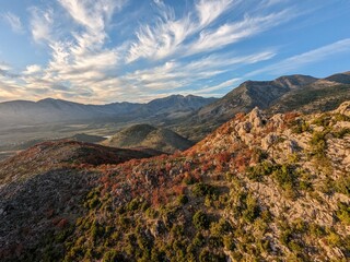 Albanian mountains aerial panorama landscape with scenic views of rocky hills near the seaside, showcasing the natural beauty of Albania.