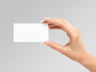 hand holding blank business card
