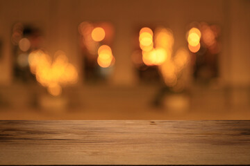 Beautiful empty wood table top counter, window view. Wooden table with blur bokeh background ready...