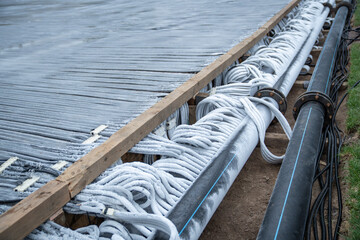 Refrigerated hoses filled with frozen water and covered with hoarfrost. Pouring of engineering...