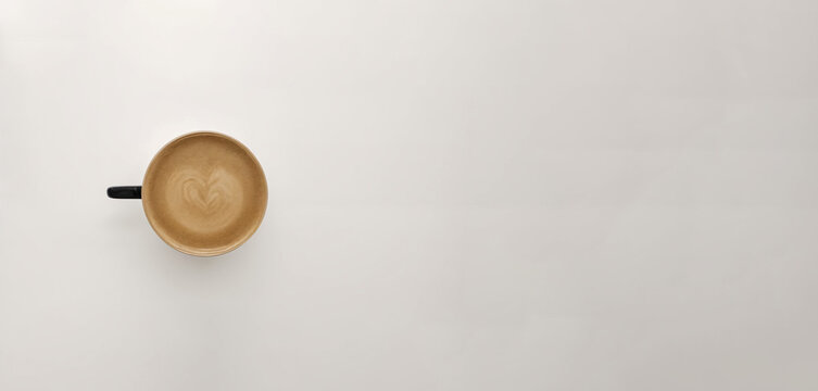Cup of coffee top view, nice gray beige background, wallpaper, minimalism