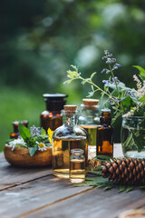 Concept of pure organic essential oil in glass bottles in cosmetology. Moisturising skin care, aromatherapy. Gentle body treatment. Atmosphere of harmony, relax. Wooden background, natural ingredients © ArtSys