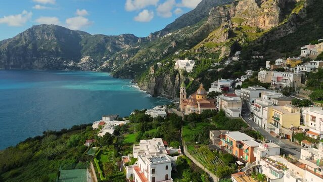 Praiano village, Amalfi coast, Italy. Aerial drone view of Praiano beautiful town - church with houses among greenery, mountains and sea. Nature and villages of Amalfi coast