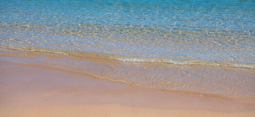 Blue ocean wave on sandy beach. Beach in sunset summer time. Beach landscape. Tropical seascape, calmness, tranquil relaxing sunlight.