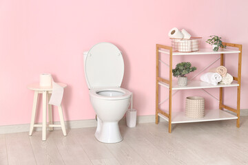 Stylish interior of modern restroom with ceramic toilet bowl