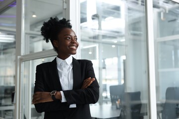 Fototapeta premium Happy woman with crossed arms in office, space for text. Lawyer, businesswoman, accountant or manager