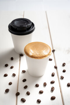 espresso takeaway coffee cup and lid
decorated with coffee
beans