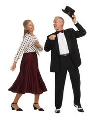 Senior couple dancing together on white background