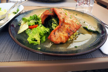 Roasted Pork made from Meat of a Black Piglet with Fresh Vegetables in Guimaraes, Portugal.
