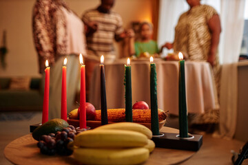 Mishumaa Saba, holder with green, Black and red candles in home where family celebrating Kwanzaa