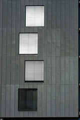 Windows on Grey Wall.  Fragment of Facade of Modern Building. Arhitectural Background.