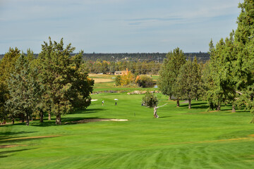 Fototapeta na wymiar Beautiful and challenging Central Oregon golf course near Redmond and Bend. Rolling terrain with view of Mt. Bachelor and featuring picturesque water hazards. Approximately 180 miles from Portland.
