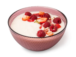 Bowl of tasty semolina porridge with fresh berries on white background