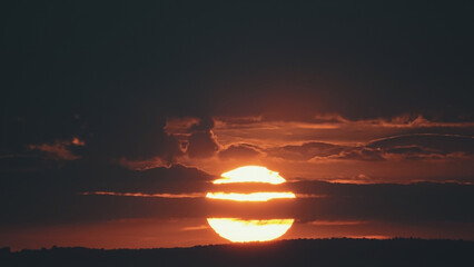 Big sun with clouds. Sunset