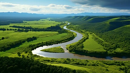 a river running through a green valley - obrazy, fototapety, plakaty