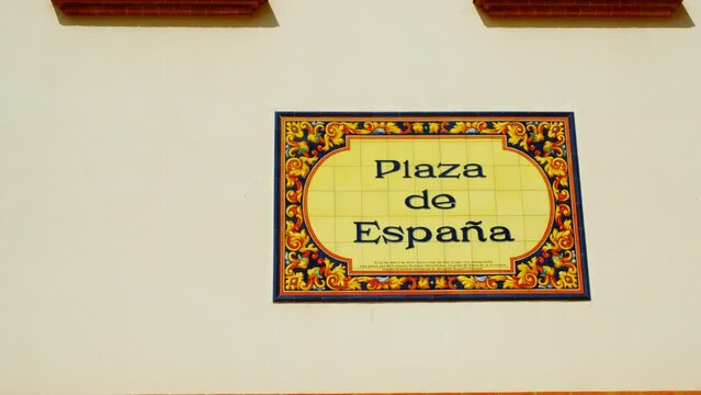 Plaza de Espana in Palos de la Frontera, Huelva, Andalucia, Spain, adorned with Spanish flags, radiates national pride and history