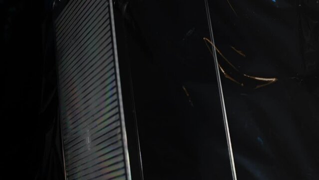 A Stylized Tech Surface rotates over dark iridescent patterns