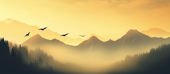 Silhouettes of mountains in the mist and bird flying in warm toning - obrazy, fototapety, plakaty