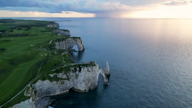 Etretat, Normandy, France, Atlantic Ocean, French holidays, landscape. Aerial 4k drone view of L'Aiguille, The Needle, Famous Alabaster chalk seacoast, Porte Aval cliffs, Natural Rock Arch Of &Eacute;tretat