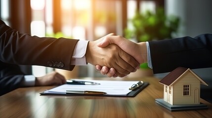 Handshake moment between landlord agent and client, sealing the deal on the signed rent contract