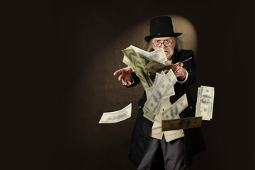 Modern times Scrooge trying to catch dollar bills, in front of a one-spot background - obrazy, fototapety, plakaty
